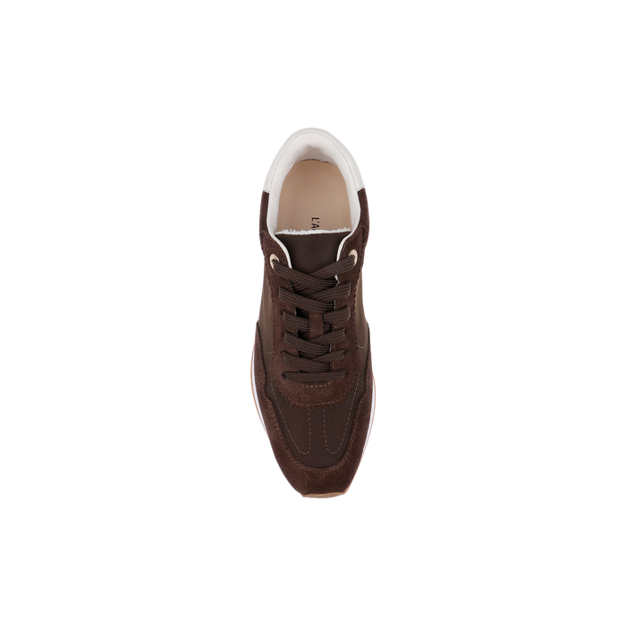 A single Deepa Platform Sneaker in chocolate suede with white accents, viewed from above and centered on a plain white background.