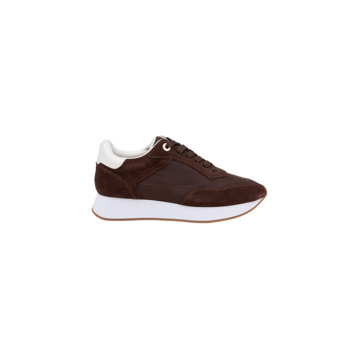 The Deepa Platform Sneaker, shown in profile on a plain white background, features chocolate suede with white accents, a thick white sole, and a memory foam insole.