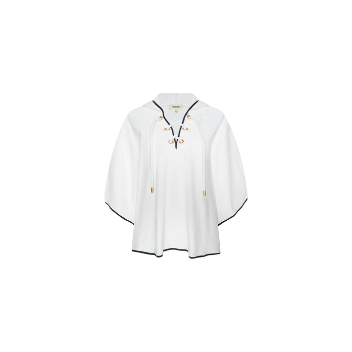 The Demeter Cover-Up Poncho is a white, poncho-style terrycloth cover-up featuring black trim, front lace-up ties, a collar, and gold accents, displayed on a plain white background.