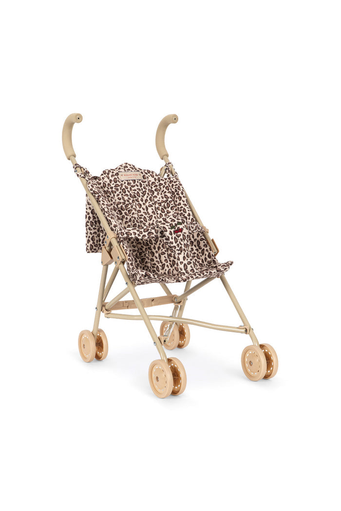 Miniature stroller with leopard print canopy on a white background