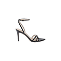 The Dua Leather Sandal is crafted from black patent leather and features a stiletto heel, thin ankle strap with buckle, open toe, and a strappy design crossing over the front of the foot. It is displayed on a white background.