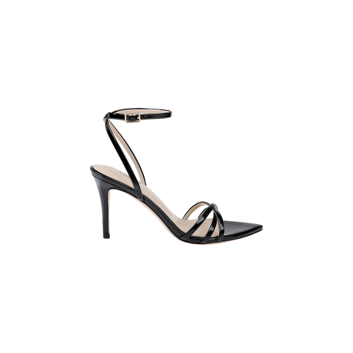 The Dua Leather Sandal is crafted from black patent leather and features a stiletto heel, thin ankle strap with buckle, open toe, and a strappy design crossing over the front of the foot. It is displayed on a white background.
