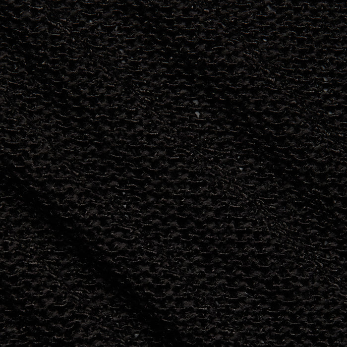 Close-up of the black textured fabric from the Ethan Knit Pullover, highlighting a rough, woven pattern with small, slightly uneven loops and ridges across the surface.