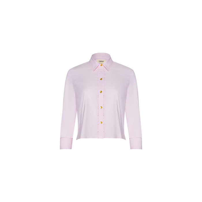 Fawn Shirt – a cropped pale pink shirt featuring long sleeves, a collar, and yellow buttons, displayed on a white background.