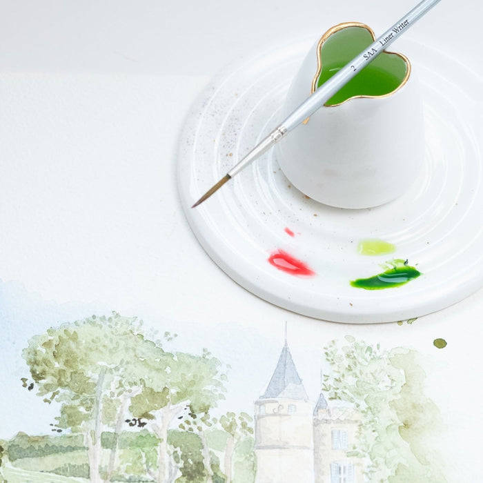 Fine Bone China Artist's Water Jug by Wendy Tournay with a paintbrush balanced on top and a palette with watercolour picture of a park