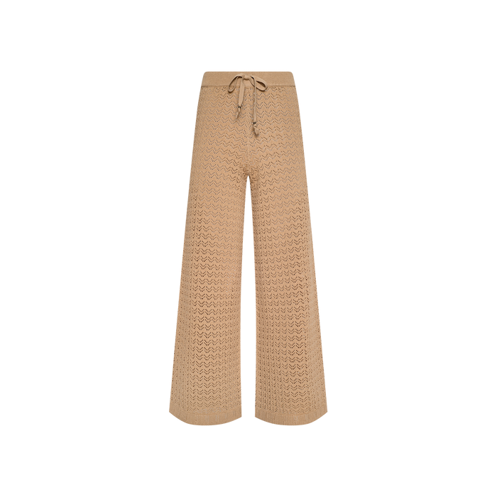 Tan wide-leg Gaelle Pointelle Knit Pant with a drawstring waist, perfect for vacation, displayed on a white background. Lightweight and stylish for warm-weather getaways.