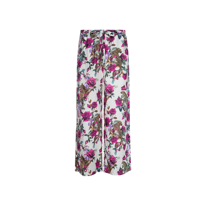 Geraldine Cover-Up Pant: Wide-leg linen resort pants with a white base, adorned with a vibrant rose leopard print and colorful floral accents in shades of pink, purple, green, and brown.