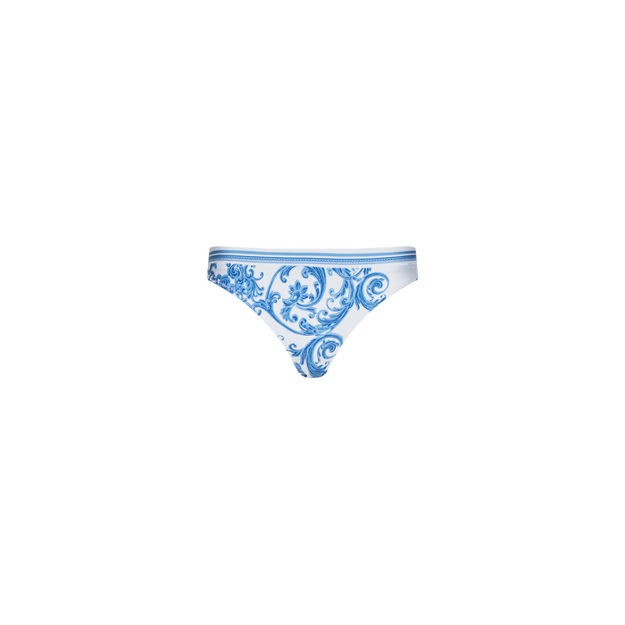 The Gianna Brazilian Bikini Bottom features a blue baroque print with ornate floral and swirl patterns on a white background. Displayed on a plain white surface, its cheeky cut offers a modern, flattering look.