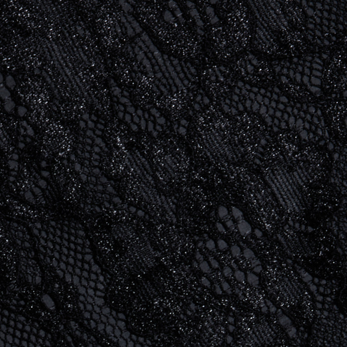 Close-up of the Henriette Cropped Lace Top in black Chantilly lace, showcasing intricate floral and mesh patterns with detailed textures and a mix of sheer and opaque areas along scalloped hems.