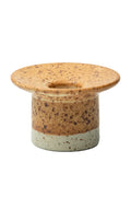 Speckled ceramic candle holder on a white background