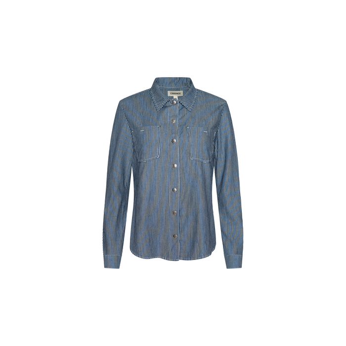 The Isla Shirt by L’AGENCE is a featherweight denim long-sleeve button-up, featuring vertical white pinstripes and two chest pockets in an indigo wash, showcased against a plain white background.