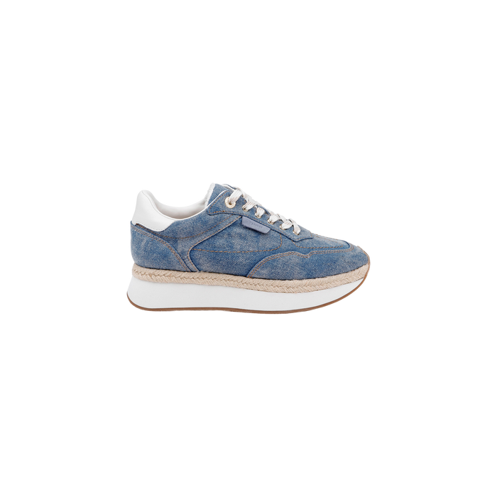 The Ivone Platform Sneaker is shown in side profile on a plain white background, featuring a blue denim upper, white laces, a thick white platform sole, brown trim, and white accents on the heel and tongue.