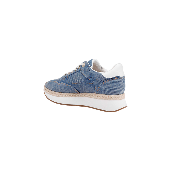 Ivone Platform Sneaker featuring a blue denim upper, white laces, white heel accent, and a thick white platform sole with tan trim, shown in profile against a plain white background.