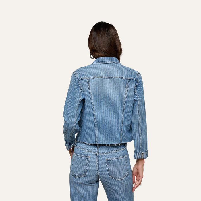 Wearing the Janelle Jean Jacket and matching jeans, a person is shown from the back against a plain light background.