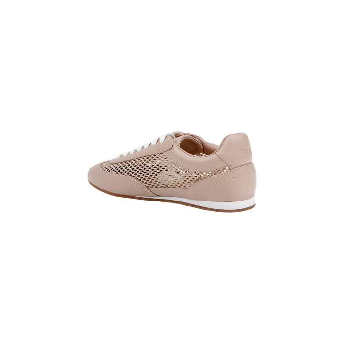 The Jarah Sneaker features a light pink colorway with a mesh side panel, white laces, and a crisp white sole with a slight platform. Subtle branding accents the heel, while its design merges retro-inspired sneaker elements with a sporty, casual aesthetic. The shoe is displayed against a plain white background.