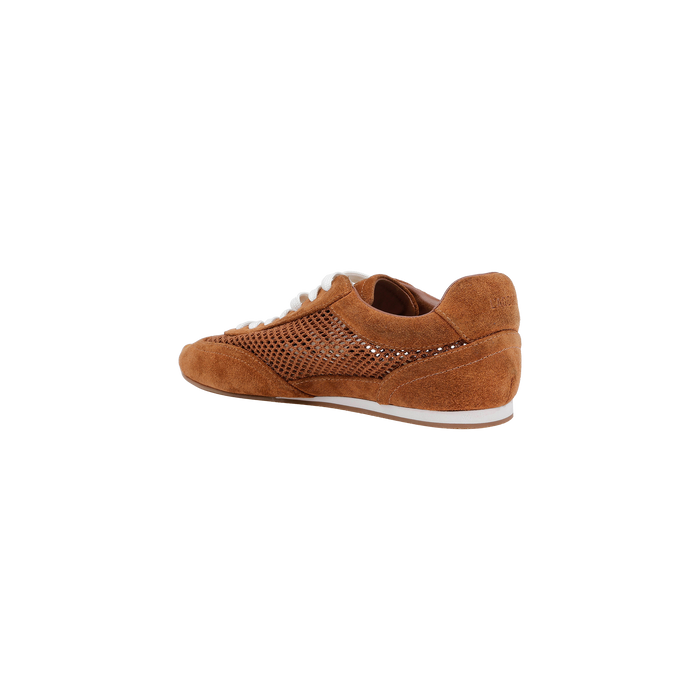 The Jarah Sneaker is crafted in brown suede with a white sole and beige laces, displayed at an angle to showcase both the side and back. Its side panel features a textured, perforated design, while a comfortable memory foam insole adds modern comfort to this retro-inspired style. The image is set against a plain white background.