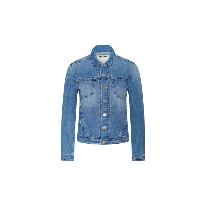 The Celine Jean Jacket is a slim fit, light denim wash piece featuring long sleeves, a button-down front, chest pockets, and a collar, displayed on a plain white background.