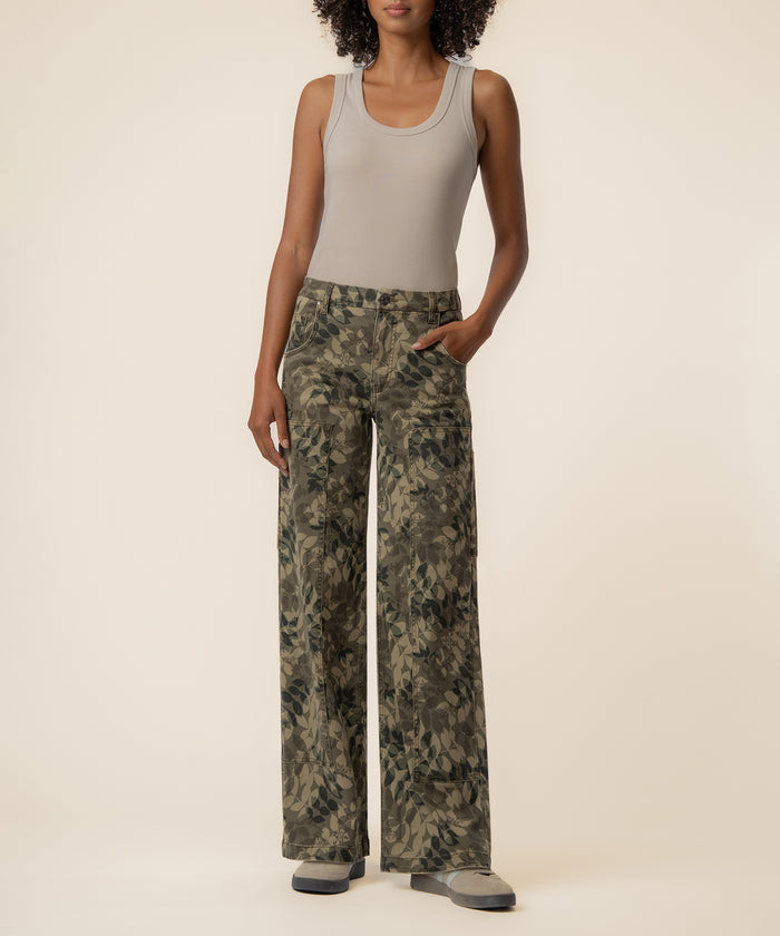 Olive patterned high-rise wide-leg jeans with straight silhouette, paired with beige sleeveless tank top.