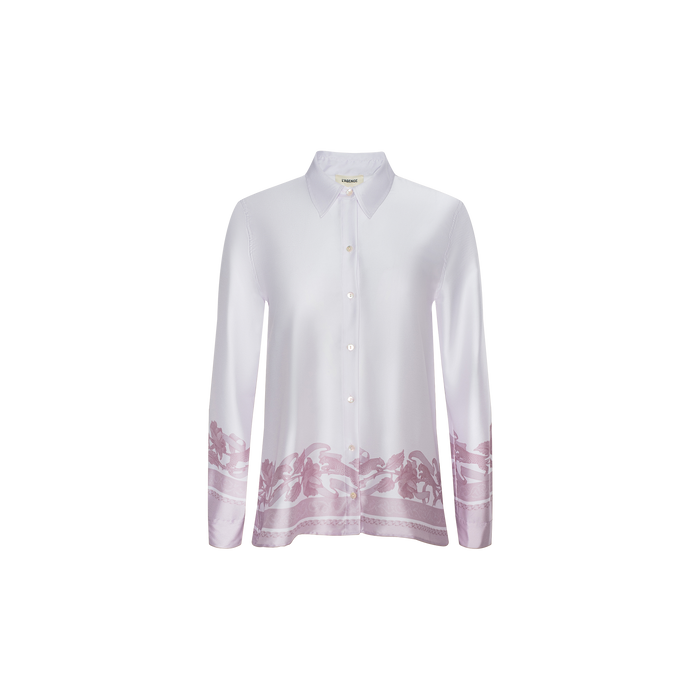 Judy Blouse: White long-sleeve button-down shirt featuring a classic collar with a purple floral pattern accenting the cuffs and lower hem, displayed on a plain white background.