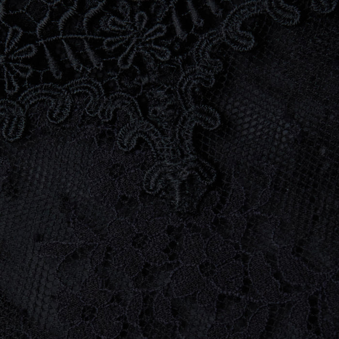 Close-up of the Kaelith Lace Bodysuit’s Chantilly floral lace, showcasing intricate black embroidery and swirling patterns on a mesh background that highlight its delicate detailing.