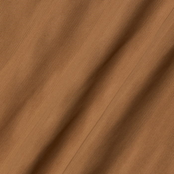 Close-up of light brown Kalea Mesh Bodysuit fabric with visible diagonal lines and subtle folds, creating a soft, rippled surface reminiscent of lightweight mesh.