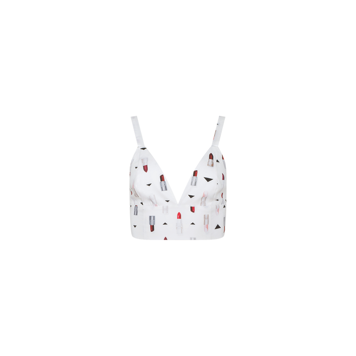 Kaori Bralette Top featuring thin straps and a colorful lipstick print pattern on the fabric, with a comfortable wide band, displayed against a plain white background.