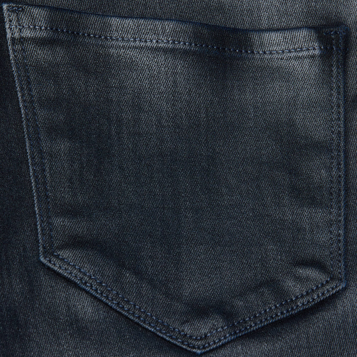 Close-up of the Kendra Coated Cropped Flare Jean’s back pocket, highlighting the visible stitching and textured dark coated denim.