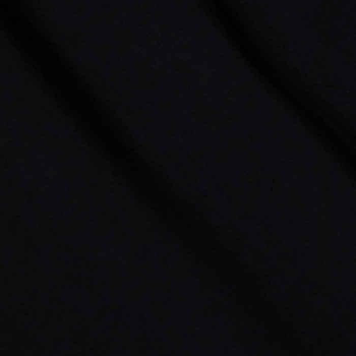 The Klaire Cover-Up Skirt features solid black viscose chiffon with subtle diagonal folds and a soft texture, creating gentle shadows across its surface.
