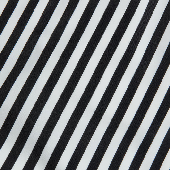 Diagonal black-and-white stripes on a smooth fabric capture the timeless elegance of French glamour, forming a bold yet minimalist pattern inspired by the Leila Halter One-Piece Swimsuit.