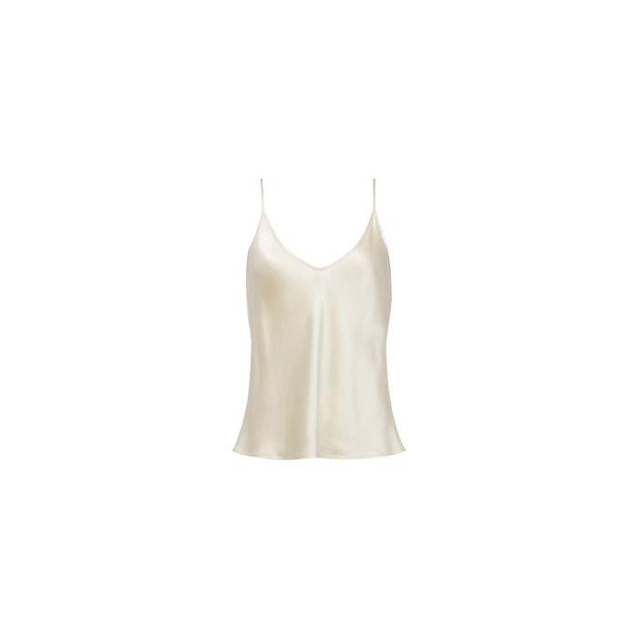 The Lexi Silk Camisole is a pearl white charmeuse top featuring thin spaghetti straps and a sleeveless design, displayed against a plain white background.