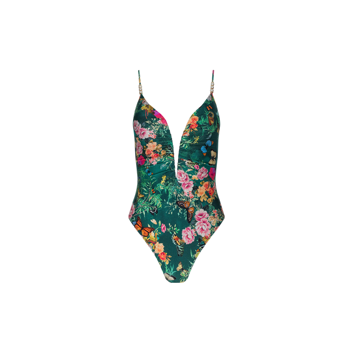 The Lilou One-Piece Swimsuit features a plunging V-wire neckline, thin straps, and a lively floral-butterfly print set against a green background.
