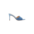 The Lolita Denim Open-Toe Mule features a light blue denim upper, a high heel, a peep-toe design, and a single wide strap, shown from the side against a plain white background.