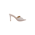 The Lolita Linen Open-Toe Mule in beige showcases a stiletto heel, pointed toe, open back, and a wide upper strap adorned with floral lace embroidery, all presented against a plain white background.