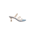 The Ludovica Kitten-Heel Sandal features three clear straps, a blue denim footbed, and a short clear flared heel, capturing the charm of a denim mule. Displayed on a white background, this style combines minimalist shoe design with contemporary materials.