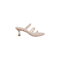 The Ludovica Kitten-Heel Sandal is a beige open-toe mule with three thin vinyl bands and a clear acrylic mid-height heel, displayed on a white background.