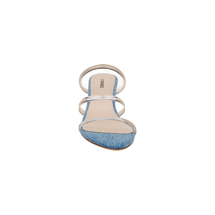 The Ludovica Kitten-Heel Sandal is a single open-toe mule featuring a denim front strap, two clear vinyl straps across the top, and a beige insole, displayed against a white background.