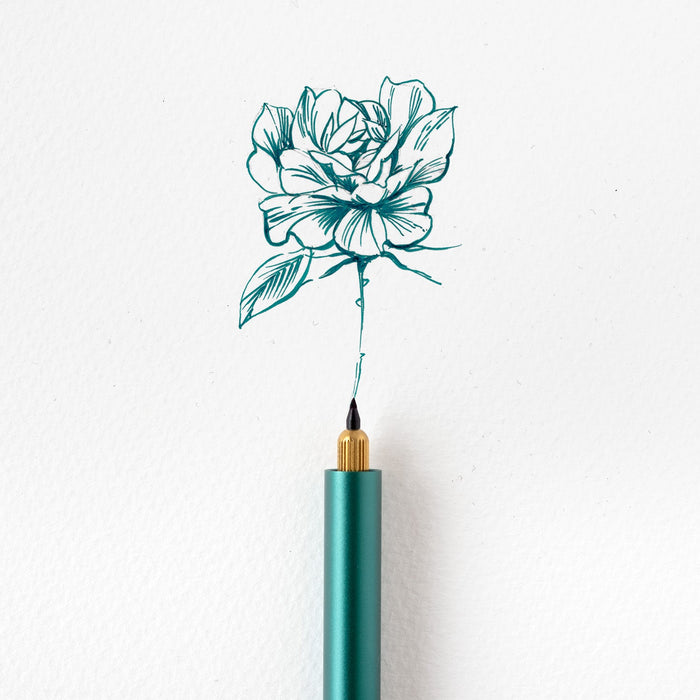 An example of a rose illustration created using the Detail Brush Tip in the Lumos, in Marianas blue/green fountain pen ink