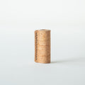 Handmade by Edward De Lacy, a pen grip and rollstop for the Lumos refillable pen – shown in natural cork