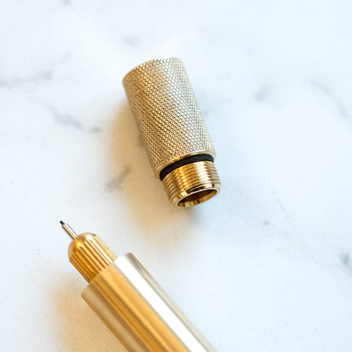 The Lumos refillable pen special edition in brass with knurled lid and fineliner tip