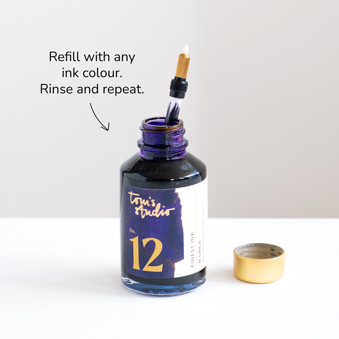 Image showing the Lumos reservoir being refilled from a bottle of Tom's Studio Fountain Pen Ink