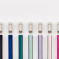A lineup of multiple Lumos Mini pens in a variety of colours each pictured with a Lumos Loop Lid, arranged neatly in a row on a white background.