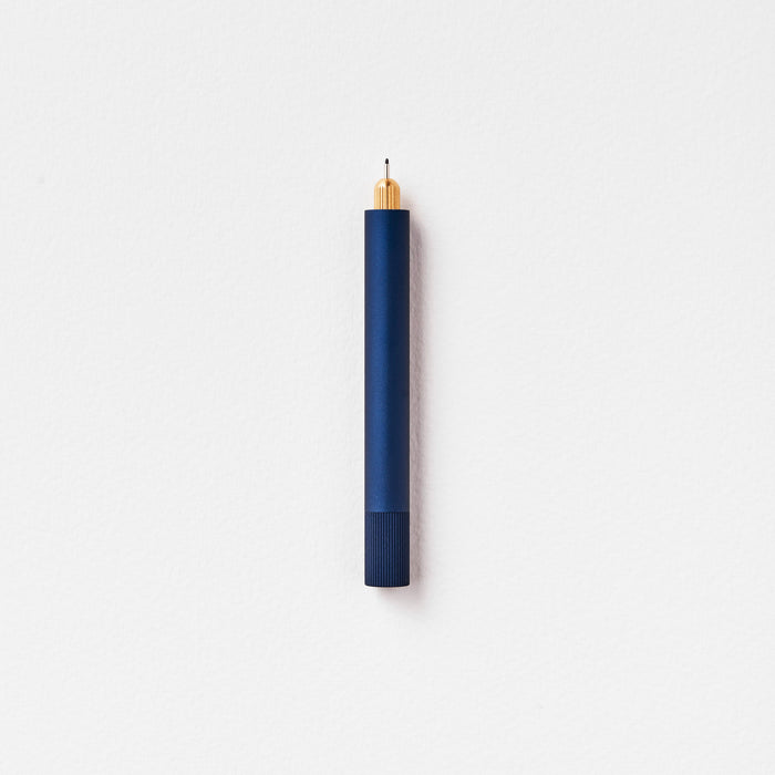 The Lumos Mini Refillable Pen in Midnight on white background