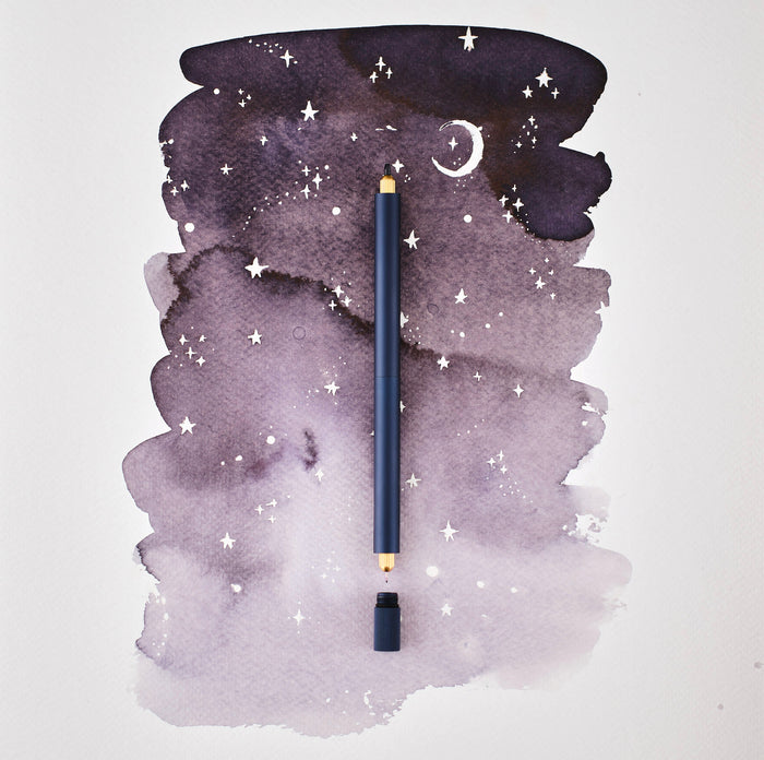 The Lumos Pro Duo Refillable Pen in Midnight on illustrative background