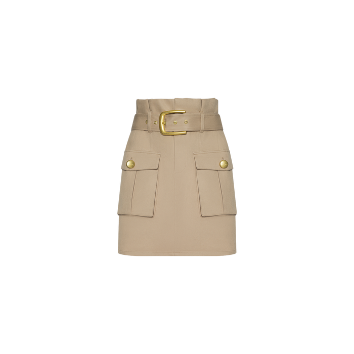The Maelis Mini Skirt is a beige, high-rise waist skirt with a wide belt and gold buckle, featuring two large front cargo pockets adorned with gold buttons, displayed on a plain white background.
