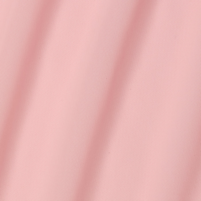 A close-up of the Mahe Mesh Cover-Up Skirt in light pink, featuring soft diagonal folds that create gentle shadows and highlight its smooth, poolside-inspired mesh texture.