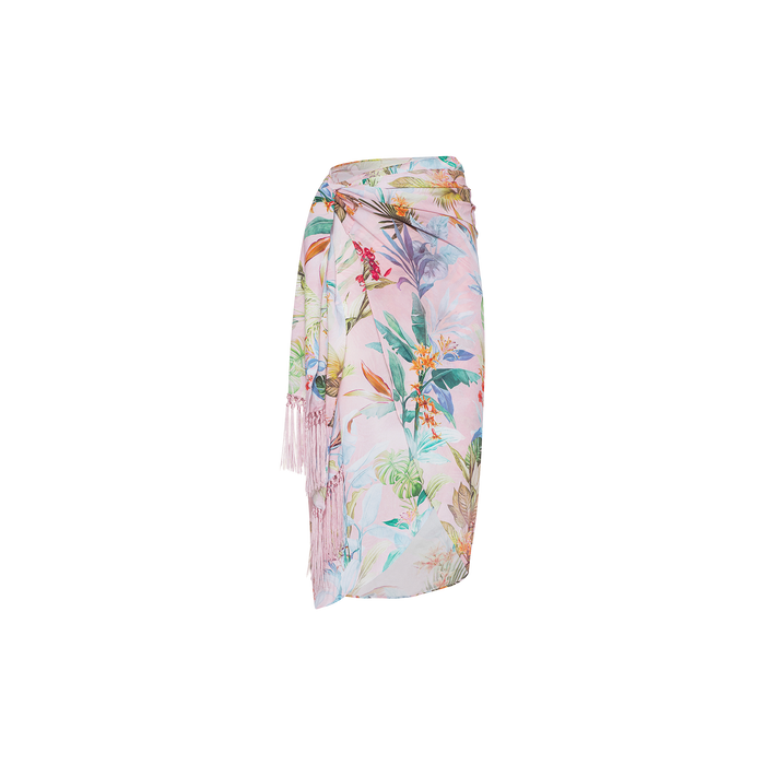 The Marena Sarong features a pastel floral print, side tie, and fringe tassels. Shown against a white background, it’s perfect as a breezy beach cover-up.