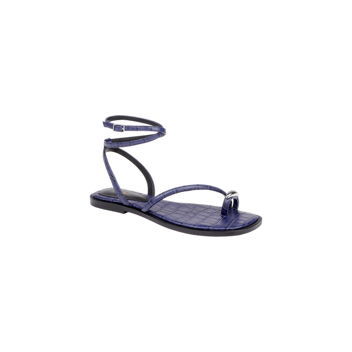The Mariana Leather Sandal is a purple flat sandal featuring a crocodile texture, a toe ring, and a wraparound ankle tie strap, displayed against a plain white background.