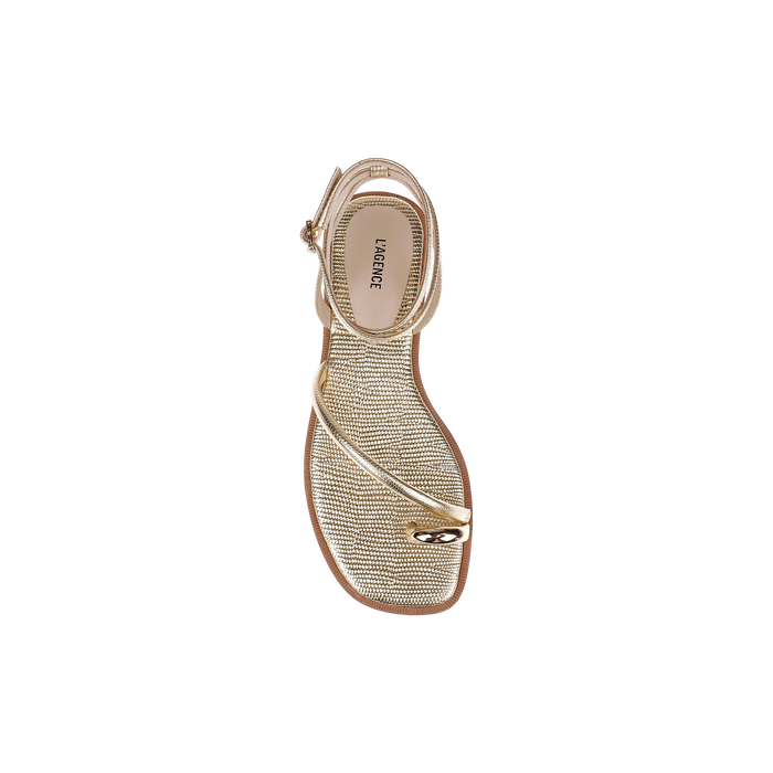Mariana Leather Sandal in gold lizard-embossed leather, featuring a textured sole, thin straps crossing over the front, and a small metallic embellishment near the toe. Photographed from above on a plain white background.