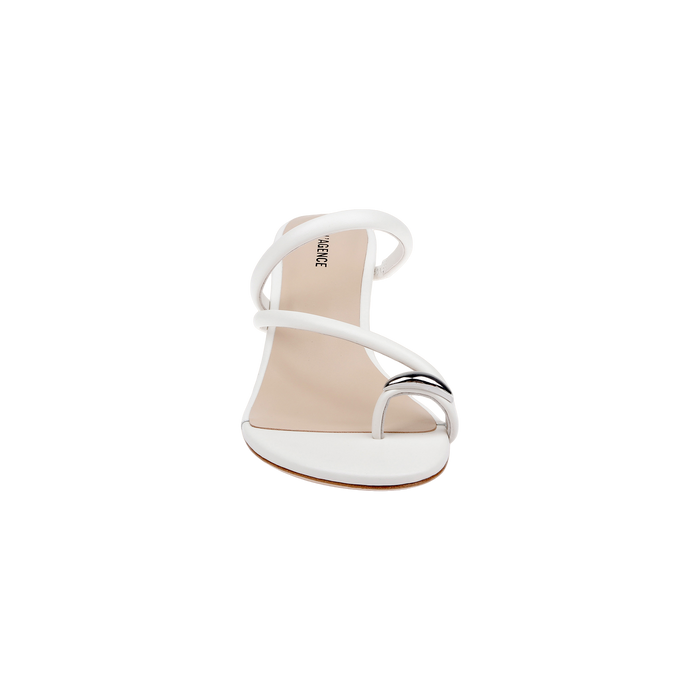 The Maritza Wedge Sandal is displayed from the front against a plain white background, showcasing its white open-toe design with a thin sole and two elegant diagonal straps—one adorned with a sleek metallic accent, and the other featuring a chic metal-capped toe ring.