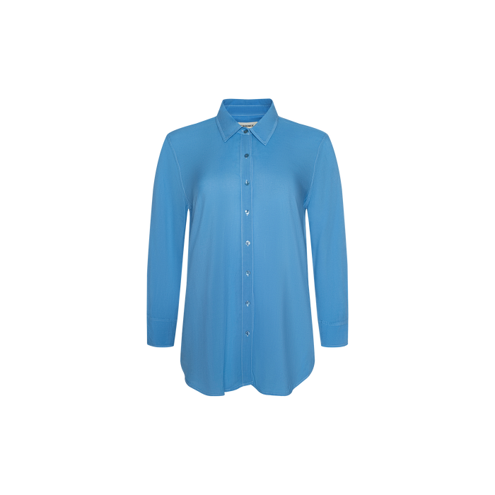 The Marlene Blouse is a long-sleeved, lightweight button-down shirt with a collar and relaxed fit, shown on a plain white background. Perfect for adding everyday polish to your wardrobe.